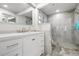 Modern bathroom with a glass-enclosed shower, marble floors and a sleek vanity at 397 Flamingo Dr, Venice, FL 34285