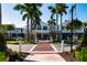 A charming historic building with a red brick crosswalk and trees lining the sidewalks at 397 Flamingo Dr, Venice, FL 34285