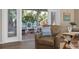 A beautiful deck with chairs visible through the open sliding glass door at 397 Flamingo Dr, Venice, FL 34285