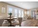 Inviting dining area with a round table, comfortable chairs, and ample natural light from nearby doors at 397 Flamingo Dr, Venice, FL 34285