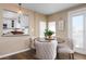 Bright dining area with comfortable seating and a view into the kitchen at 397 Flamingo Dr, Venice, FL 34285