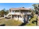 Elevated home with large decks, offering outdoor living space and natural light at 397 Flamingo Dr, Venice, FL 34285