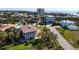 Charming coastal home featuring a spacious elevated rooftop deck, lush landscaping and a front porch at 397 Flamingo Dr, Venice, FL 34285