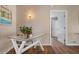 Hallway with a decorative desk and artwork at 397 Flamingo Dr, Venice, FL 34285
