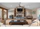 Living room with a stone fireplace, beverage fridge and 'Beach House' sign at 397 Flamingo Dr, Venice, FL 34285