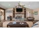 Living room with a stone fireplace, beverage fridge and 'Beach House' sign at 397 Flamingo Dr, Venice, FL 34285