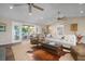 Bright living area with sliding doors to deck, modern decor and ceiling fans at 397 Flamingo Dr, Venice, FL 34285