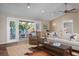 Open living room with a ceiling fan, recessed lighting, and sliding glass doors to the deck at 397 Flamingo Dr, Venice, FL 34285