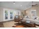 Bright living area with sliding doors to deck, modern decor and ceiling fans at 397 Flamingo Dr, Venice, FL 34285