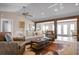 Spacious living room featuring high ceilings, wood beams, and an open layout leading to other living spaces at 397 Flamingo Dr, Venice, FL 34285