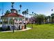 Picturesque park scene featuring a charming white gazebo, trees, and a well-maintained lawn at 397 Flamingo Dr, Venice, FL 34285