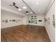 Brightly lit common room with wood-look floors, and track lighting at 4238 Mackay Falls Ter, Sarasota, FL 34243