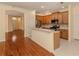 Open concept kitchen with breakfast bar and adjacent to living and entry areas at 4238 Mackay Falls Ter, Sarasota, FL 34243