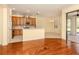 Bright kitchen with stainless appliances open to the dining area with access to the lanai at 4238 Mackay Falls Ter, Sarasota, FL 34243