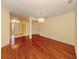 Living room showcasing wood floors and chandelier at 4238 Mackay Falls Ter, Sarasota, FL 34243