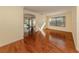 Spacious living room features wood floors with view to lanai, large window for abundant natural light at 4238 Mackay Falls Ter, Sarasota, FL 34243