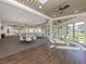 Spacious meeting room featuring hard floors, neutral colors, and plenty of natural light at 4238 Mackay Falls Ter, Sarasota, FL 34243