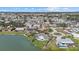 This aerial view displays waterfront homes with docks and gorgeous landscaping at 424 Shade Ter, Venice, FL 34293
