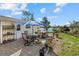 This backyard boasts patio furniture, a jacuzzi, landscaping and a partial water view at 424 Shade Ter, Venice, FL 34293