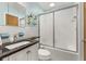Cozy bathroom featuring a frosted glass shower door, toilet, and vanity with a sink at 424 Shade Ter, Venice, FL 34293