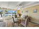 Bright dining space with water view, decorative rug and seating for four at 424 Shade Ter, Venice, FL 34293