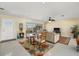 Cozy living room features tile floors, neutral paint, a ceiling fan and natural light at 424 Shade Ter, Venice, FL 34293