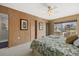 Main bedroom featuring lake views, ensuite bathroom and walk in closet at 424 Shade Ter, Venice, FL 34293