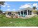 Back patio featuring a full wall of windows and a seating area perfect for relaxing and enjoying the view at 424 Shade Ter, Venice, FL 34293