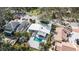 Aerial view of home showcasing the pool, patio, landscaping, and neighborhood at 432 Palmetto Ct, Venice, FL 34285
