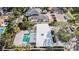 Aerial view of a home highlighting the pool, patio, well-maintained landscaping, and neighborhood at 432 Palmetto Ct, Venice, FL 34285