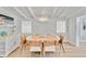 Charming dining area with a round table, modern chairs, and bright, neutral decor at 432 Palmetto Ct, Venice, FL 34285
