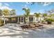 Charming single-story home featuring a carport and tropical landscaping at 432 Palmetto Ct, Venice, FL 34285