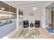 Enclosed patio area featuring neutral tile floors and wicker seating at 432 Palmetto Ct, Venice, FL 34285