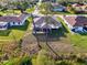 Aerial view of a home with large screened lanai and mature trees in a quiet residential neighborhood at 4332 Big Leaf St, North Port, FL 34286