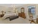 Bright bedroom with ensuite bathroom, large windows, and natural light at 4332 Big Leaf St, North Port, FL 34286