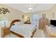 Bedroom featuring a ceiling fan, bed, window, and a dresser at 4332 Big Leaf St, North Port, FL 34286