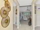 Bright hallway leading to a cozy living room with comfortable seating at 4332 Big Leaf St, North Port, FL 34286