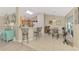 Bright open kitchen with bar seating flows into a cozy dining area with charming decor at 4332 Big Leaf St, North Port, FL 34286