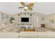Coastal living room with large sectional seating and a vaulted ceiling at 4332 Big Leaf St, North Port, FL 34286