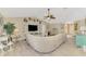 Open living room with a large white sectional sofa and views of other living areas at 4332 Big Leaf St, North Port, FL 34286