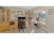 Bright office space with large window, built-in cabinets, and a neutral color palette at 4332 Big Leaf St, North Port, FL 34286