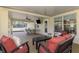 An outdoor patio includes living and dining spaces, with views of a pool and verdant foliage at 4332 Big Leaf St, North Port, FL 34286