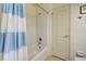 Bathroom shower and tub combination featuring a bright, white shower curtain and chrome fixtures at 4425 Corso Venetia Blvd # A20, Venice, FL 34293