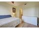 Bedroom with closet, drawer, and fan with natural light at 4425 Corso Venetia Blvd # A20, Venice, FL 34293