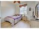 Serene bedroom offering a double bed, a ceiling fan, side tables and a dresser for comfortable living at 4425 Corso Venetia Blvd # A20, Venice, FL 34293