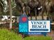 The Venice Beach community sign, with attractive landscaping, under the shade of palm trees at 4425 Corso Venetia Blvd # A20, Venice, FL 34293