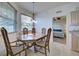Dining room with natural light from the windows and ceiling light at 4425 Corso Venetia Blvd # A20, Venice, FL 34293