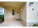 Welcoming front entrance features a cream door, neutral exterior, and a small window at 4425 Corso Venetia Blvd # A20, Venice, FL 34293