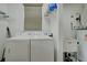 Laundry room with updated appliances including a washer and dryer and laundry accessories nearby at 4425 Corso Venetia Blvd # A20, Venice, FL 34293