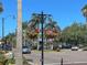 Lovely street view with vibrant hanging flower baskets and decorative street lamps, creating a welcoming atmosphere at 4425 Corso Venetia Blvd # A20, Venice, FL 34293
